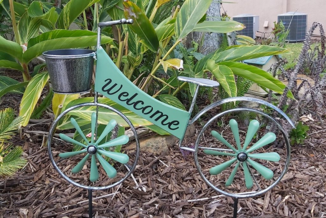 Welcome sign in front garden